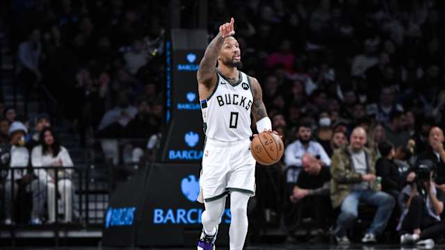 Milwaukee Bucks guard Damian Lillard (0) sets the play 
